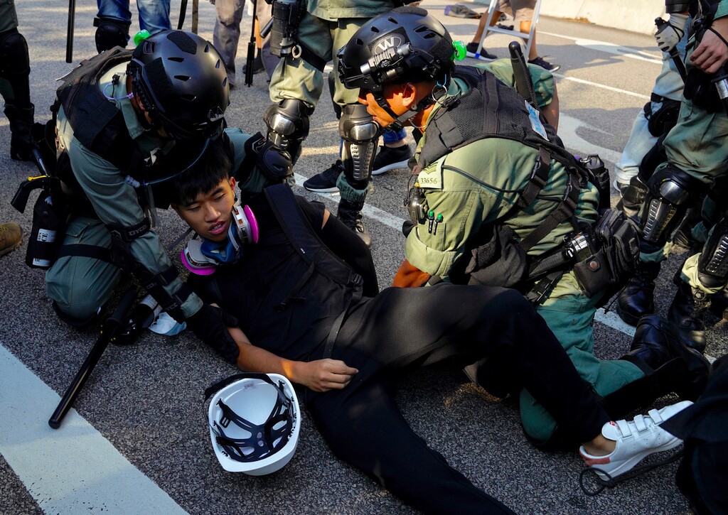 (Vincent Yu | AP Photo) Police detain a protester in Hong Kong on Saturday, Sept. 21, 2019. Demonstrators have marched through an outlying district of Hong Kong in another weekend of protest aimed at the Chinese territory's government.