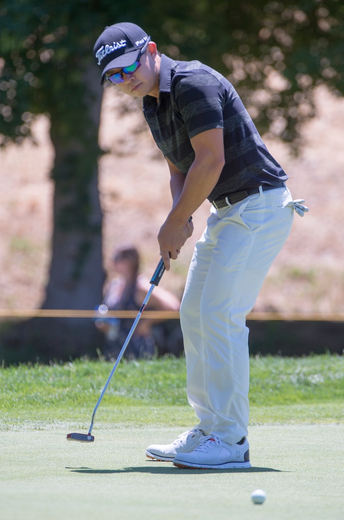 (Rick Egan  |  The Salt Lake Tribune)     Seokwon Jeon, from Draper Utah, hits a putt during the second round of the Utah Championship golf event on the Web.com Tour at Oakridge Country Club in Farmington. July 13, 2018.



