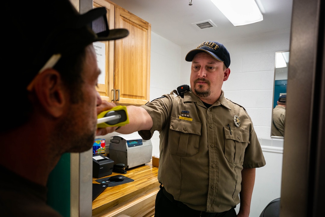 (Trent Nelson  |  The Salt Lake Tribune)  
Sergeant Dustin Anthon administers breath tests as part of Weber County's 24/7 Sobriety Program in Ogden on Thursday, Aug. 22, 2019.