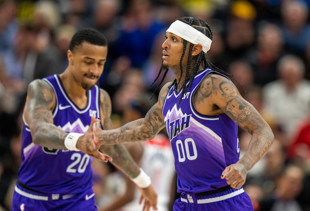 (Rick Egan | The Salt Lake Tribune)  Utah Jazz forward John Collins (20) slaps hands with guard Jordan Clarkson (00), after Clarkson hit a 3-pointer to extent the Jazz lead late in the 4th quarter, in NBA action at the Delta Center, on Monday, March 4, 2024.
