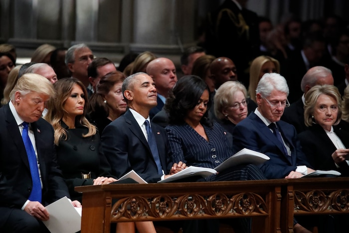 From left, President Donald Trump, first lady Melania Trump, former President Barack Obama, Michelle Obama, former President Bill Clinton and former Secretary of State Hillary Clinton listen during a State Funeral at the National Cathedral, Wednesday, Dec. 5, 2018, in Washington, for former President George H.W. Bush.(AP Photo/Alex Brandon, Pool)