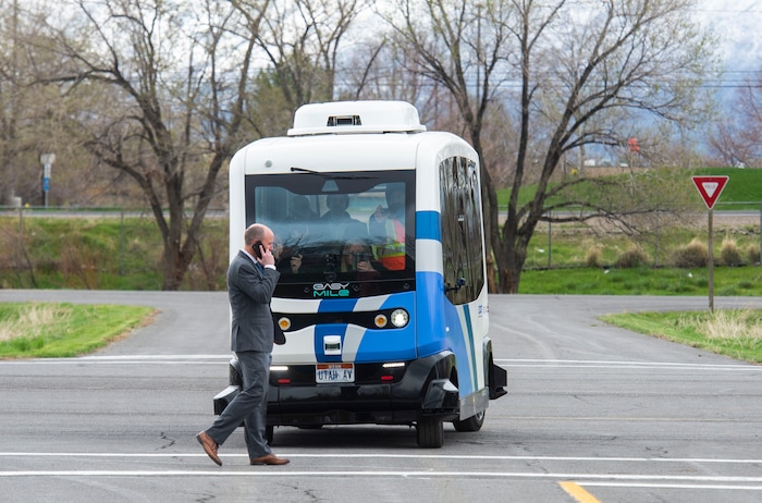 (Rick Egan  |  The Salt Lake Tribune)   Lt. Governor Spencer J. Cox walks in front of an Autonomous Shuttle, to see if it will stop for him, during a demonstration as the Utah Department of Transportation, in partnership with the Utah Transit Authority, launched a new Autonomous Shuttle Pilot Project at the test track is across the street from UDOT headquarters on the west side of 2700 West. Thursday, April 11, 2019.


