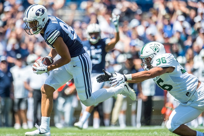 (Chris Detrick  |  The Salt Lake Tribune)  Brigham Young Cougars wide receiver Neil Pau'u (84) runs for a touchdown past Portland State Vikings linebacker Sam Bodine (36) during the game at LaVell Edwards Stadium Saturday, August 26, 2017.