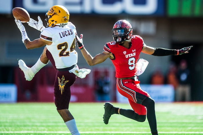 (Chris Detrick  |  The Salt Lake Tribune)  Arizona State Sun Devils defensive back Chase Lucas (24) intercepts the ball intended for Utah Utes wide receiver Darren Carrington II (9) during the game at Rice-Eccles Stadium Saturday, October 21, 2017. 