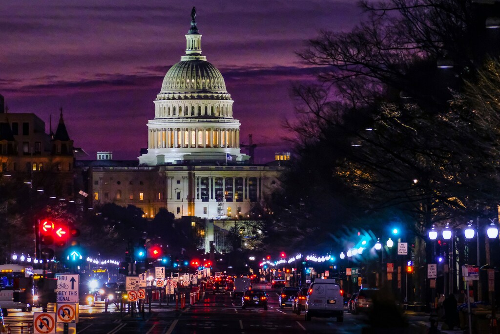 (AP Photo/J. David Ake, File) In Dec. 14, 2016 file photo, early morning traffic rolls down Pennsylvania Avenue toward the U.S. Capitol as daybreaks in Washington.
