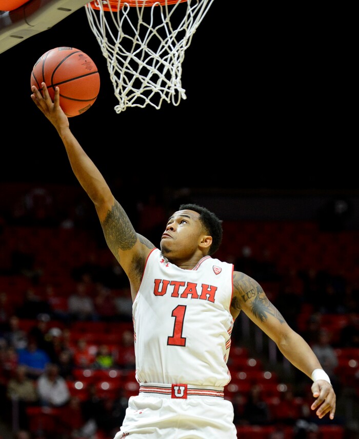 (Steve Griffin  |  The Salt Lake Tribune)  Utah Utes guard Justin Bibbins (1) drives gets tot he basket for two during the Utah versus UC Davis men's NIT basketball game at the Huntsman Center in Salt Lake City Wednesday March 14, 2018.