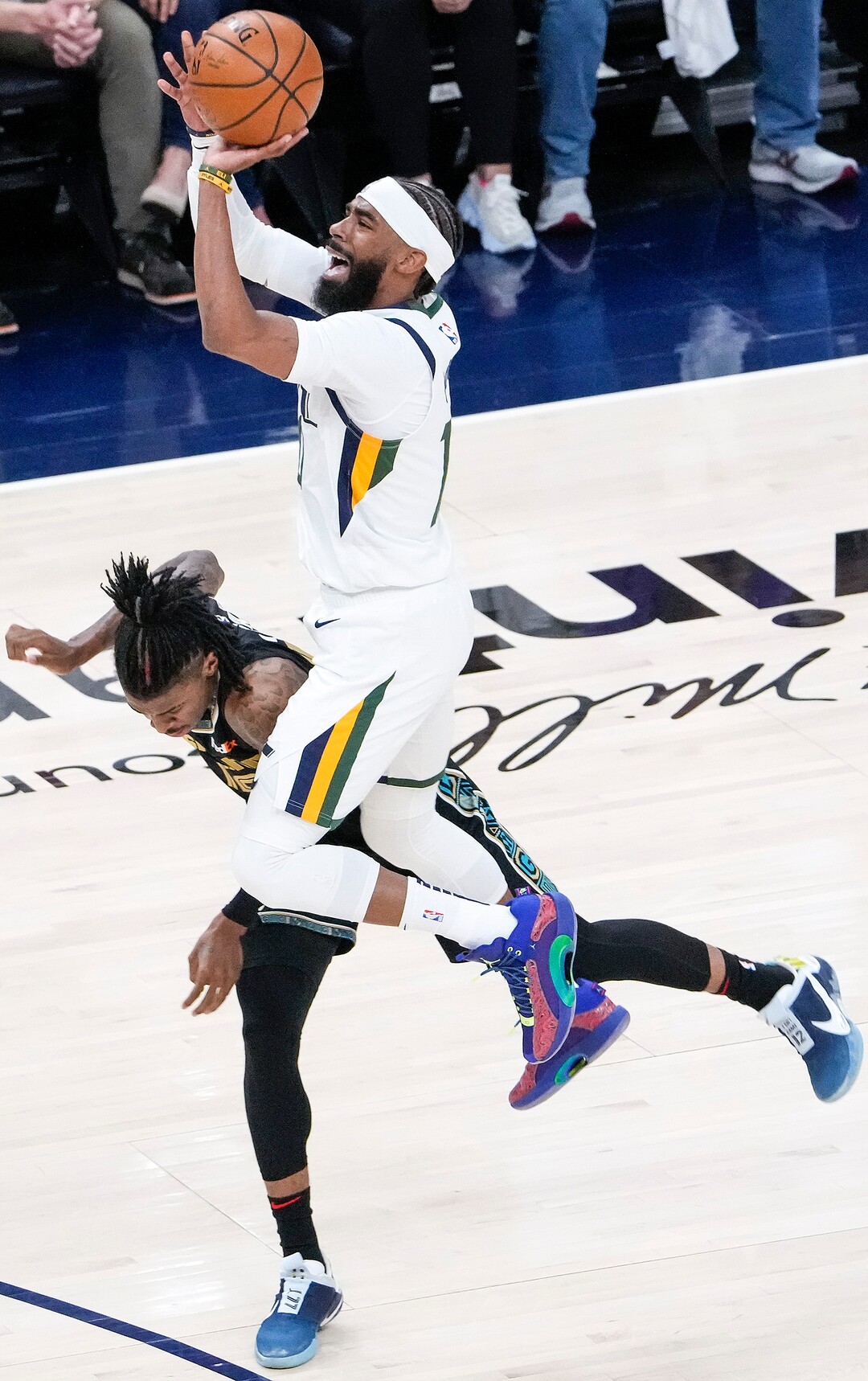 (Leah Hogsten | The Salt Lake Tribune) Memphis Grizzlies guard Ja Morant (12) fouls Utah Jazz guard Mike Conley (10) as the Utah Jazz take on the Memphis Grizzlies during Game 1 of the first-round playoffs at Vivint Arena, May 23, 2021.