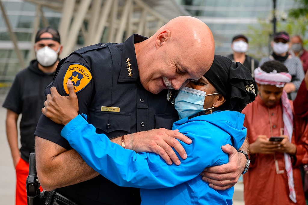 (Trent Nelson  |  The Salt Lake Tribune) Fatima Dirie embraces Salt Lake City Police Chief Mike Brown following a rally in Salt Lake City on Saturday, June 6, 2020.
