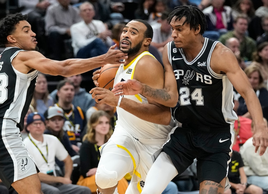 (Leah Hogsten | The Salt Lake Tribune) Utah Jazz guard Talen Horton-Tucker (0) is pressured by San Antonio Spurs guard Tre Jones (33) and San Antonio Spurs guard Devin Vassell (24) as the Utah Jazz host the San Antonio Spurs in pre-season play at Vivint Arena, Oct. 10, 2022,