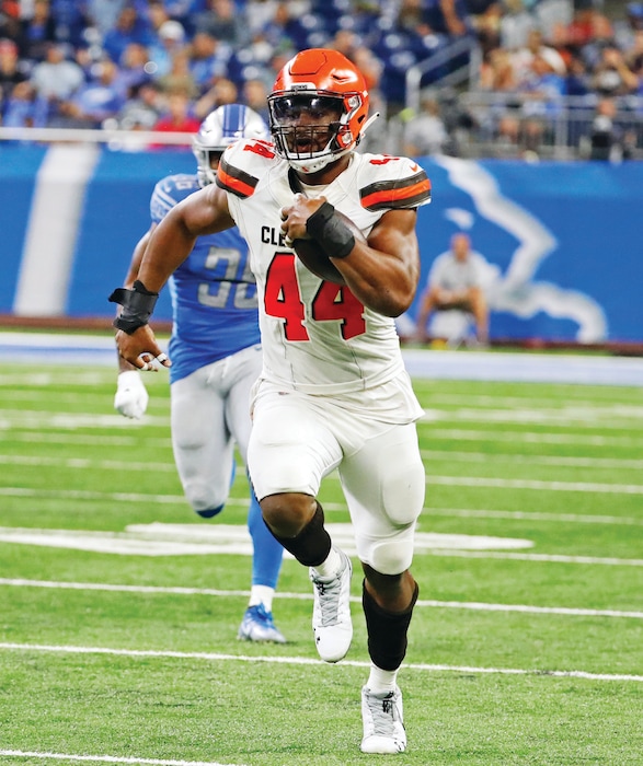 Cleveland Browns defensive end Nate Orchard (44) returns an interception for a 64-yard touchdown during the first half of an NFL football preseason game against the Detroit Lions, Thursday, Aug. 30, 2018, in Detroit. (AP Photo/Rick Osentoski)