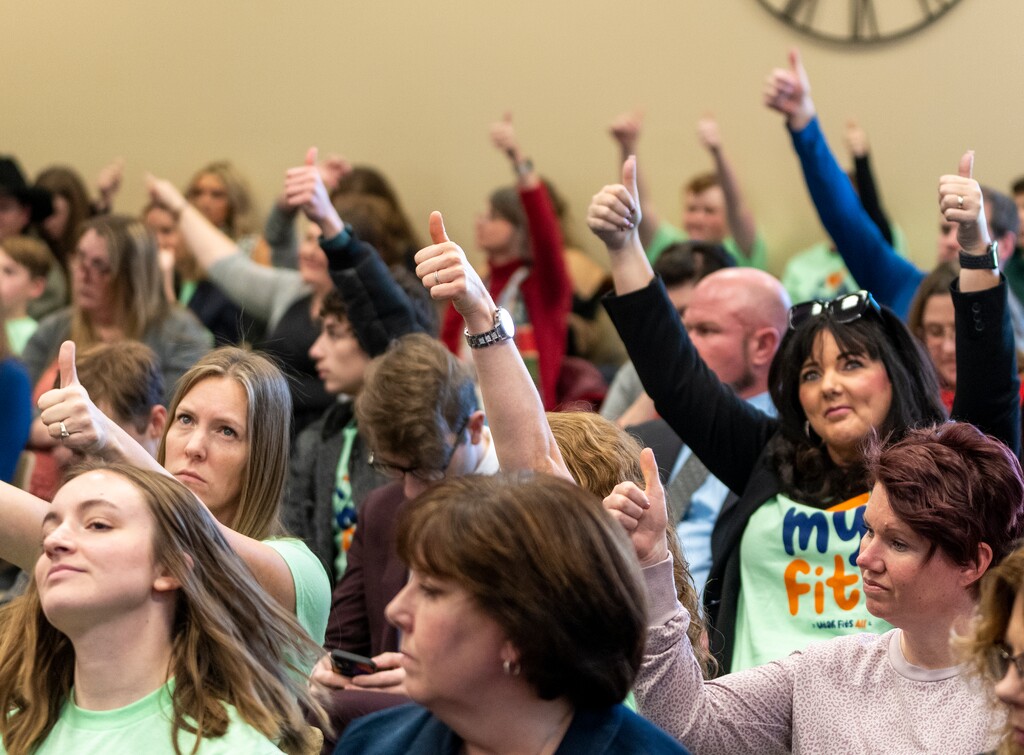 (Rick Egan | The Salt Lake Tribune) People give a thumbs up as they agree with one of the speakers during the Senate Education Committee public comment period about HB215 on Monday, Jan. 23, 2023. The bill, which will set up a voucher system in the state, passed a final vote in the full Utah Senate on Thursday, Jan. 26, 2023.