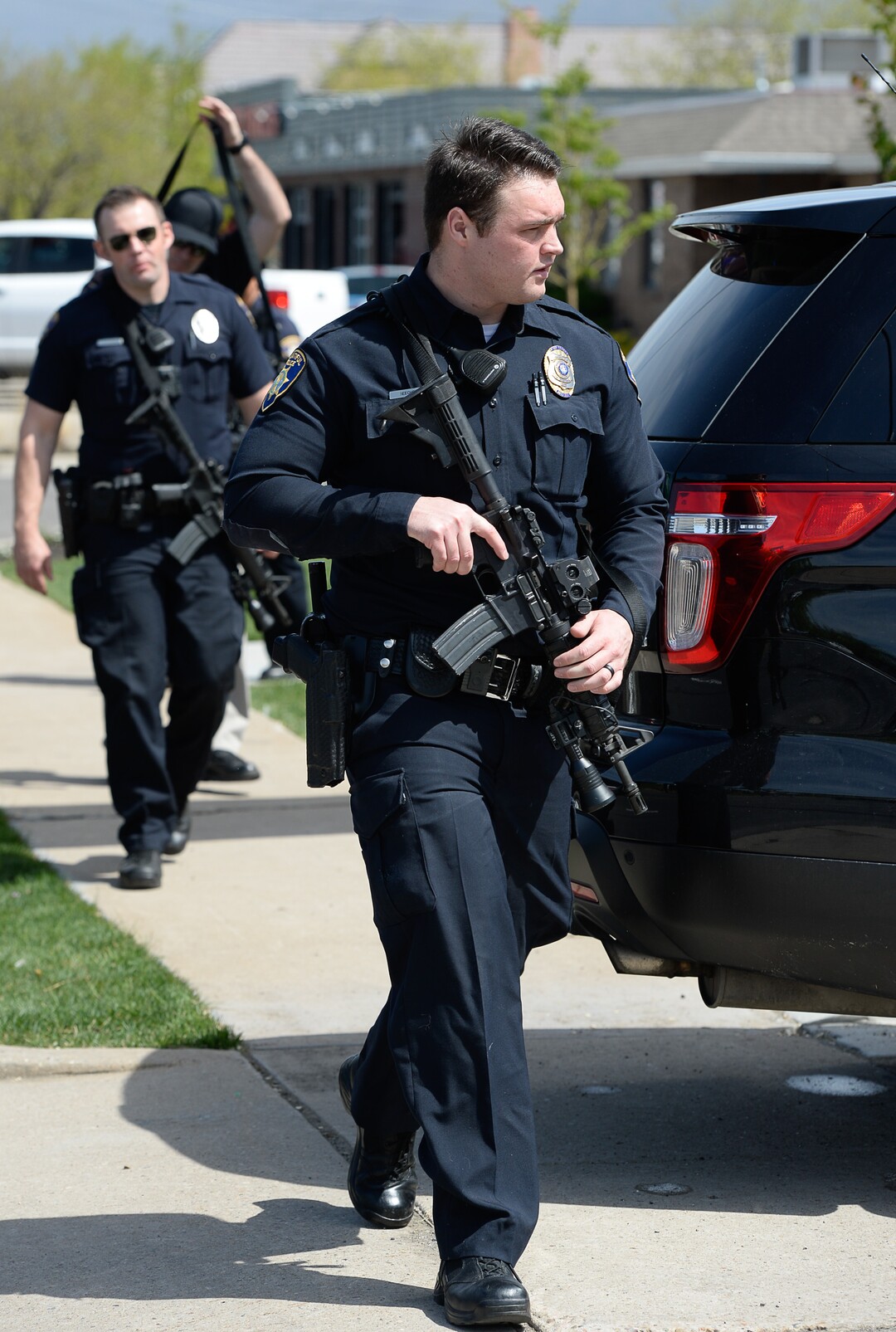 (Francisco Kjolseth  |  The Salt Lake Tribune)  Police work the scene of a shooting at Pawn and Sales, 135 S. and 500 West, in Bountiful on Friday, May 4, 2018, where two men attempted to rob the store. One suspect was killed in a "scuffle" with a staff member while the other one fled the scene.