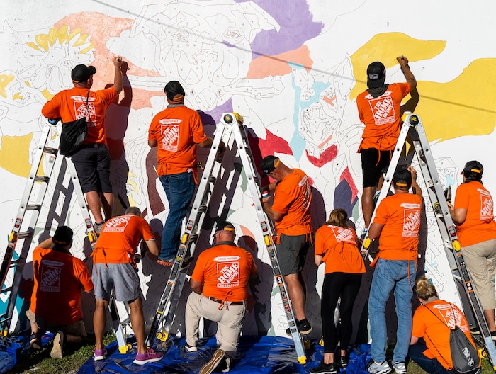 (Rick Egan | The Salt Lake Tribune) More than 600 volunteers, led by Home Depot employees, help spruce up the Sunrise Metro and Freedom Landing apartments in Salt Lake City on Wednesday, Sept. 21, 2022.