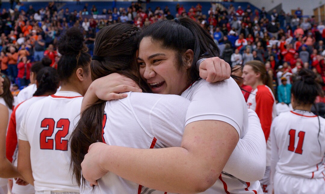 (Leah Hogsten  |  The Salt Lake Tribune)  East's Lani Taliauli (54)celebrates the win with East's Lealani Falatea (03). East defeated Timpview 68-48 to win the the 5A High School Girls' Basketball Tournament title at SLCC in Taylorsville, Saturday, Feb. 24, 2018. 