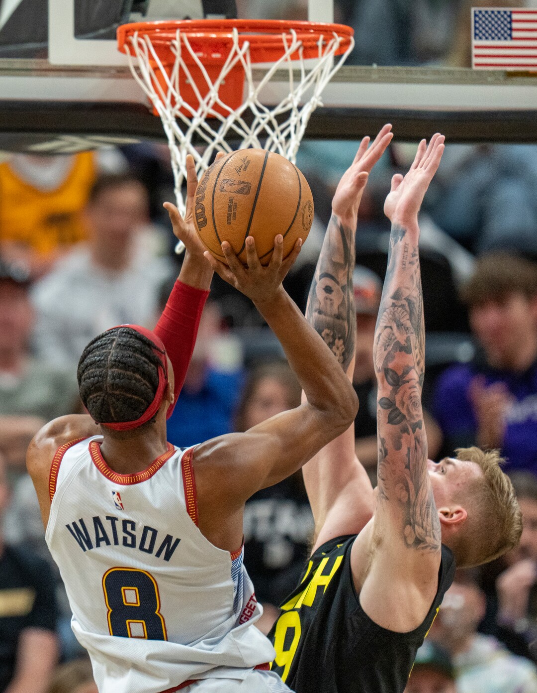 (Rick Egan | The Salt Lake Tribune) in Denver Nuggets forward Peyton Watson (8) shoots as Luka Samanic defends for the Jazz, in NBA action between the Utah Jazz and the Denver Nuggets at Vivint Arena,  Saturday, April 8, 2023.