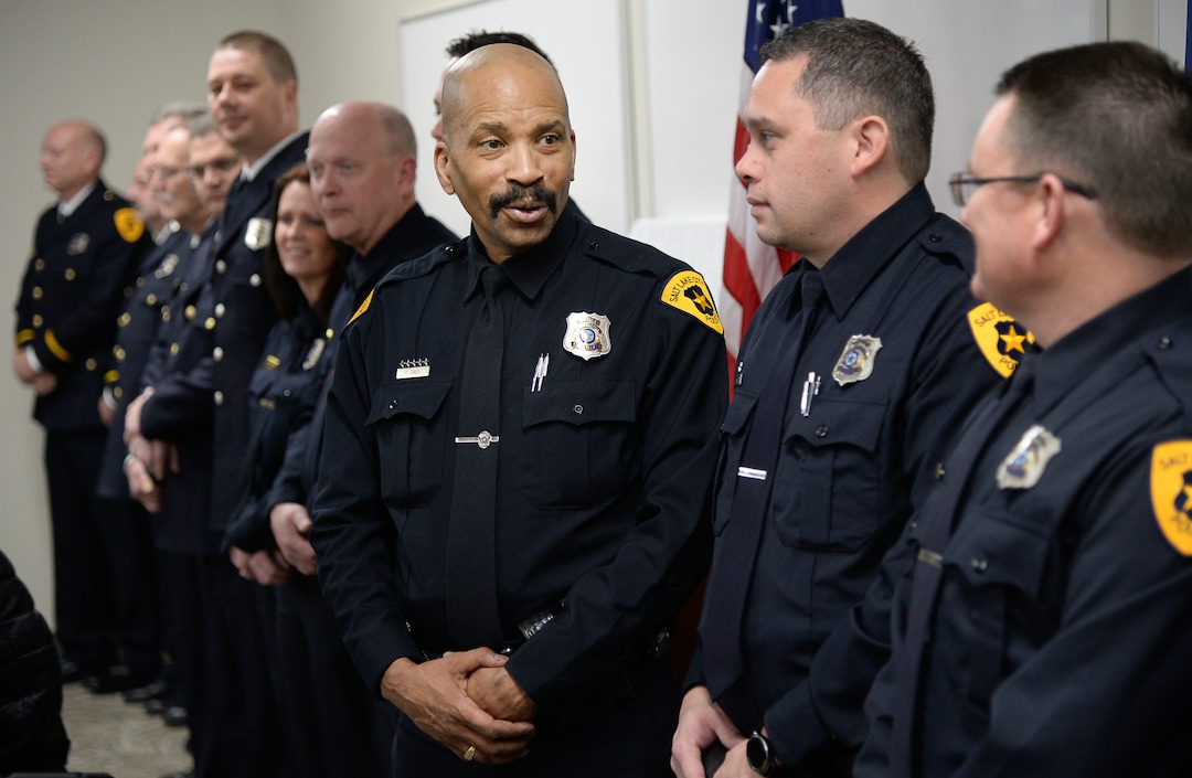 (Francisco Kjolseth  |  The Salt Lake Tribune)  Salt Lake City Airport Police officer Chris Barker, center, joins fellow airport officers during a ceremony to retire their former patch and badge as they are subsumed into the Salt Lake City Police Department on Tuesday, Feb. 26, 2019. 