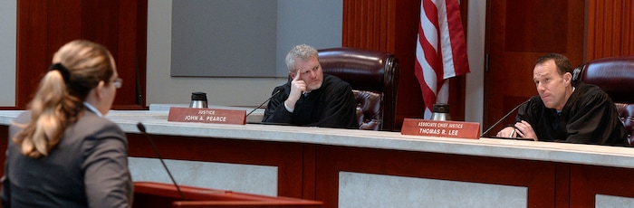 (Al Hartmann  |  The Salt Lake Tribune) 	
Federal public defender Charlotte Merrill, left, argues before the Utah Supreme Court Wednesday Jan. 10. Justice John Pearce, and Associate Chief Justice Thomas Lee listen to her argument. 
The court heard arguments regarding Anthony Michael Archuleta, 55, who has been on death row since his conviction in 1989 for the Nov. 21, 1988, torture slaying of Gordon Ray Church, a 28-year-old Southern Utah State College theater student, at a remote location in Millard County. In separate trials, Archuleta and co-defendant Lance Conway Wood each were convicted of capital murder. Wood was sentenced to life in prison. Archuleta was sentenced to death. 