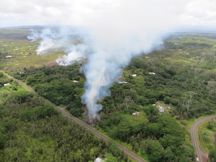 This Friday, May 4, 2018, aerial image released by the U.S. Geological Survey, eruptive area showing recent fissures in Leilani Estates subdivision when photo was taken at 12:07 p.m. HST. Fissure 5 is shown in the forefront in the Big Island of Hawaii, Hawaii. The Kilauea volcano sent more lava into Hawaii communities Friday, a day after forcing more than 1,500 people to flee from their mountainside homes, and authorities detected high levels of sulfur gas that could threaten the elderly and people with breathing problems. (U.S. Geological Survey via AP)