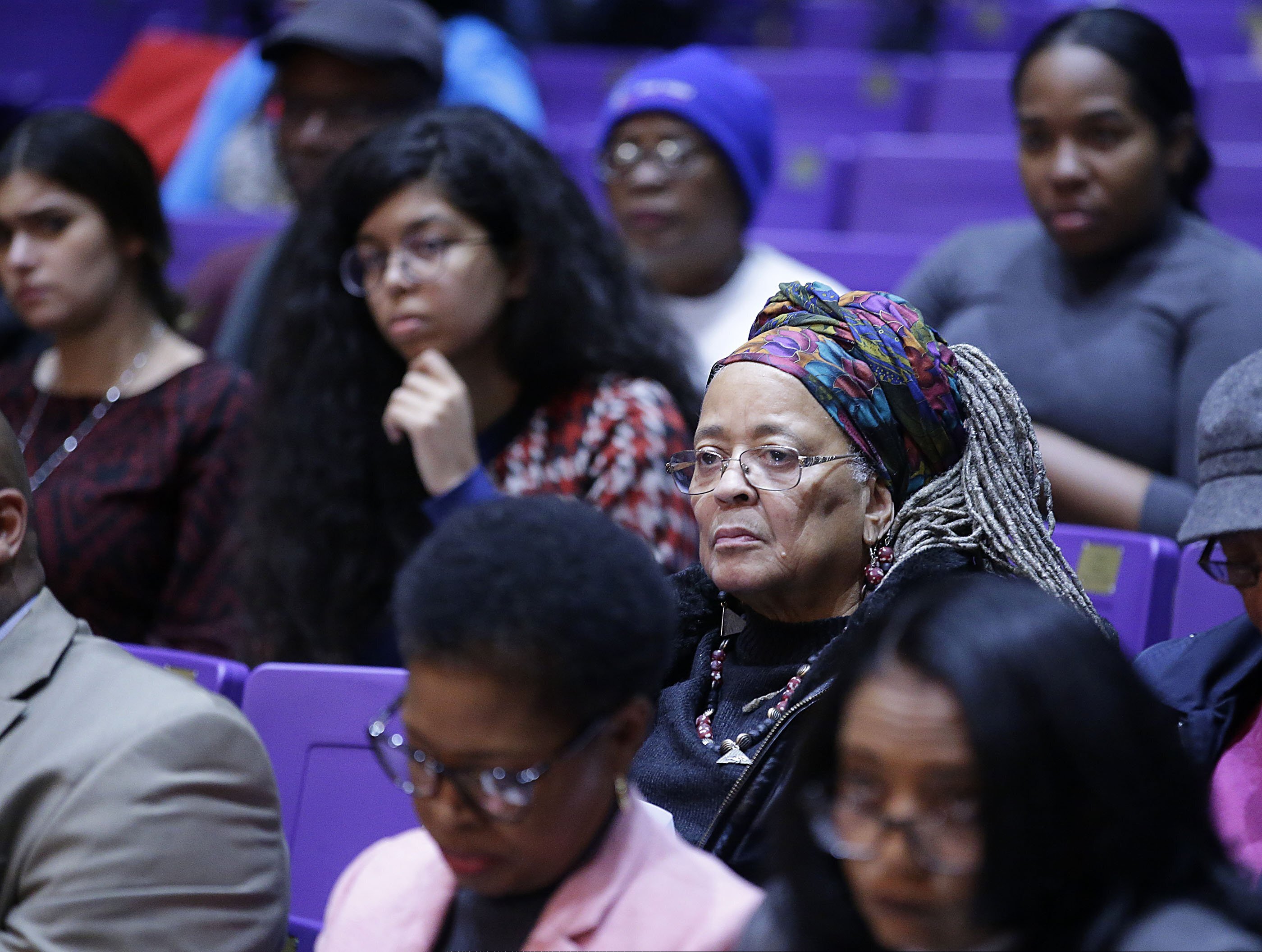 In this Monday, Dec. 16, 2019, photo, community members listen during a public oversight committee meeting in Tulsa, Okla., to announce initial results of the search for mass graves related to the 1921 Tulsa Race Massacre. (Mike Simons/Tulsa World via AP)