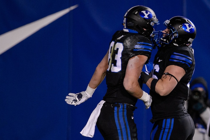 (Trent Nelson | The Salt Lake Tribune) Brigham Young Cougars tight end Isaac Rex (83) and Brigham Young Cougars tight end Carter Wheat (96) celebrate a touchdown as BYU hosts San Diego State, NCAA football in Provo on Saturday, December 12, 2020.