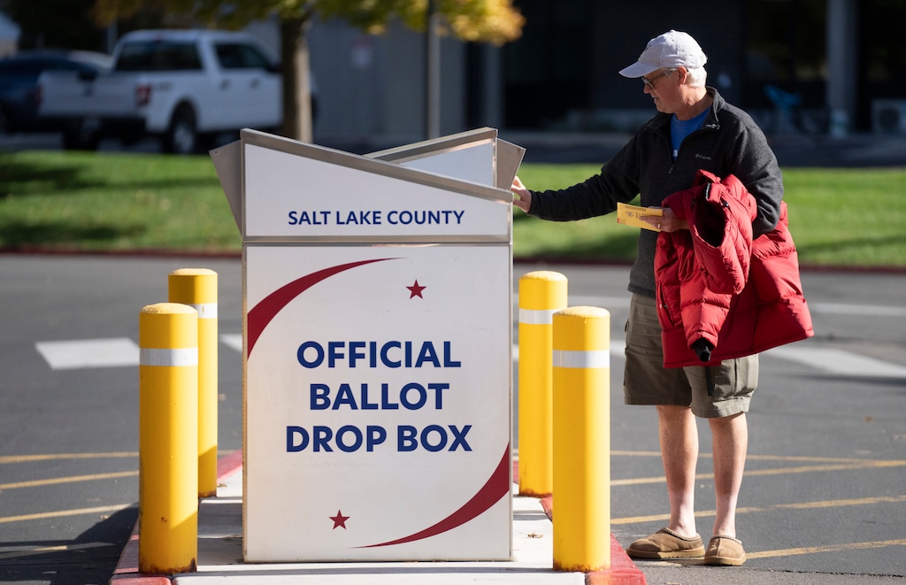 (Rick Egan | The Salt Lake Tribune)  Travis Drown deposits his ballot in the drop box at Salt Lake County Government Center, on Wednesday, Oct. 30, 2024.