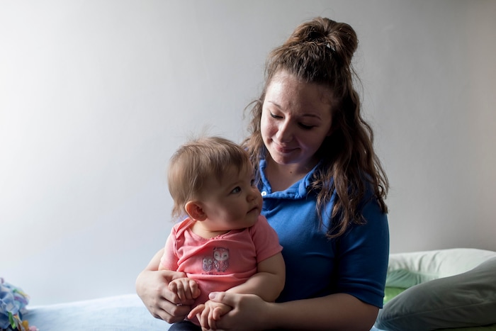 Inmate Destiny Doud poses for a portrait in her room with her 10-month-old daughter, Jaelynn Purcell, at Decatur Correctional Center in Decatur, Illinois on April 9, 2018.  (Whitney Curtis | The Washington Post)