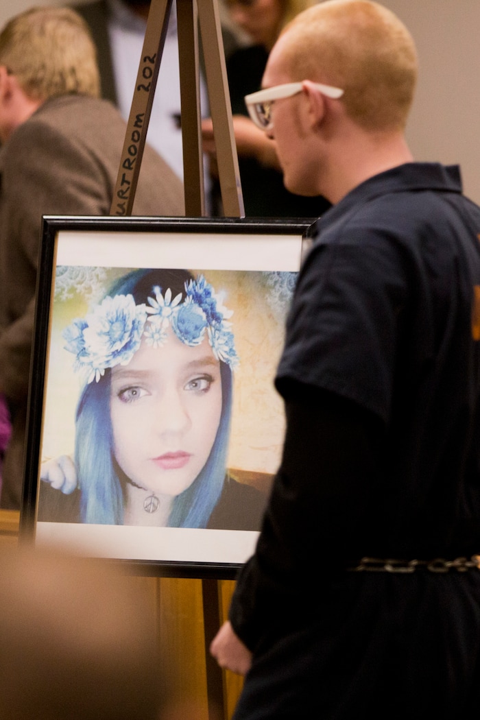 Tyerell Przybycien walks by a photo of Jchandra Brown during Przybycien's sentencing in the 4th District Court on Friday, Dec. 7, 2018, in Provo. 