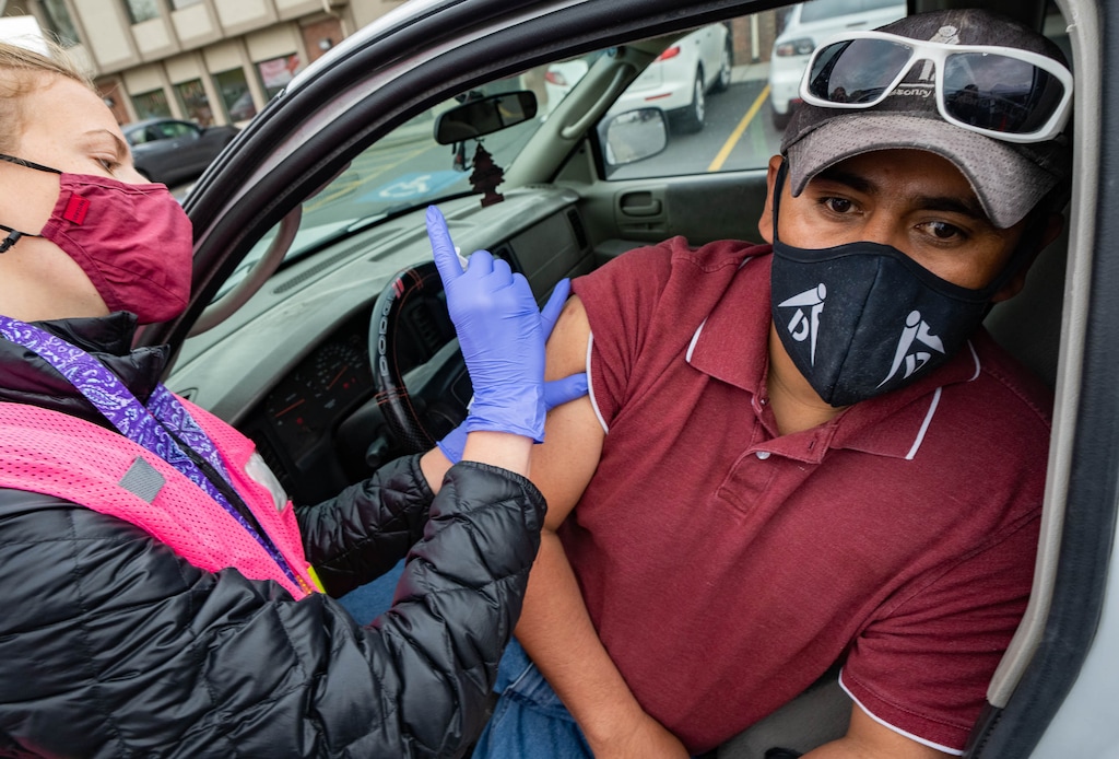 (Francisco Kjolseth | The Salt Lake Tribune) Lauro Martinez receives his first dose of the COVID-19 vaccine from Rachelle Peltier with the Salt Lake County Health Department during a mobile clinic provided for the Hispanic community at 339 East 3900 South in Salt Lake City, on Saturday, April 24, 2021.
