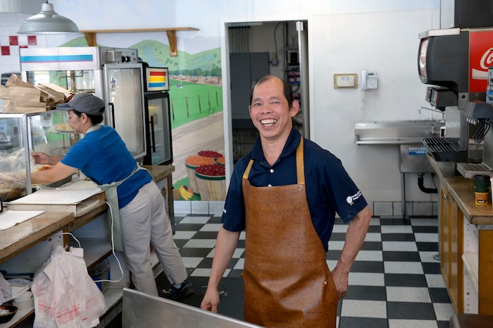 (Al Hartmann | The Salt Lake Tribune) Kevin Nguyen is quick with a smile to his hungry customers at Kevin's Fried Chicken, located inside the Food Mart/Gas Station at 524 W. 4500 South in Murray. Nguyen has a secret recipe for the spicy breading, using real chicken pieces (not pressed).