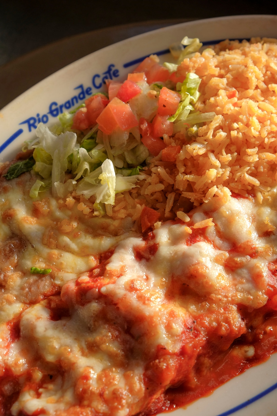 (Leah Hogsten  |  The Salt Lake Tribune) Rio Grande Cafe's Cheese enchilada with black olives, salsa and sour cream covered with homemade enchilada sauce and cheese, $11.99. Salt Lake City's popular Rio Grande Cafe, which has been closed since March due to the pandemic and the earthquake, has moved to its new location near the University of Utah on 1300 East, Dec. 29, 2020.