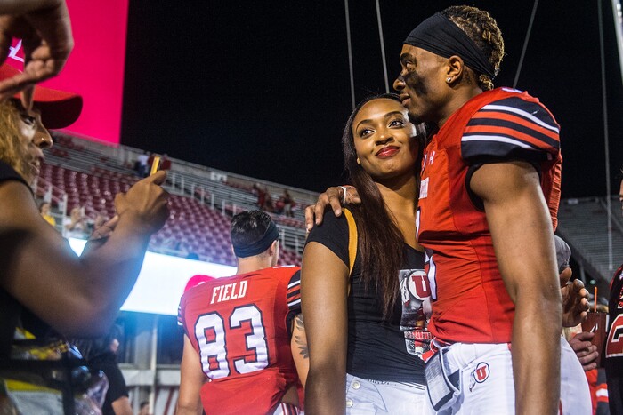 (Chris Detrick | The Salt Lake Tribune) Utah Utes wide receiver Darren Carrington (9) hugs his sister DiJonai Carrington after the game at Rice-Eccles Stadium Thursday, August 31, 2017. Utah Utes defeated North Dakota Fighting Hawks 37-16.