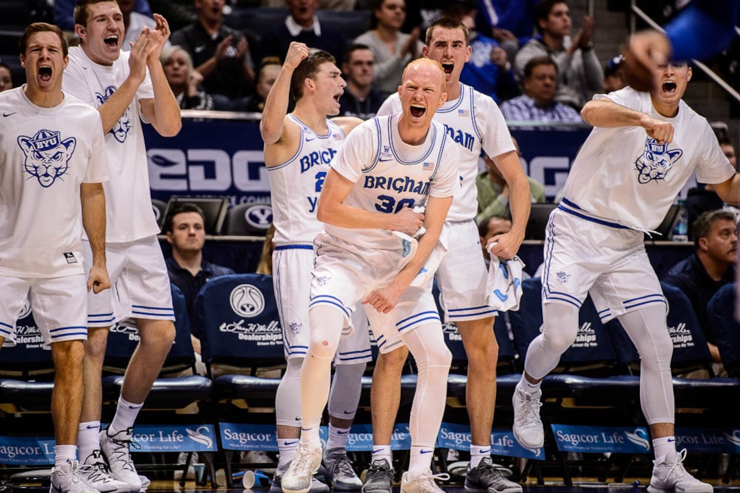 (Trent Nelson | The Salt Lake Tribune)  The BYU bench, including Brigham Young Cougars guard TJ Haws (30), celebrate a foul as BYU hosts Utah State, NCAA basketball in Provo on Wednesday Dec. 5, 2018.