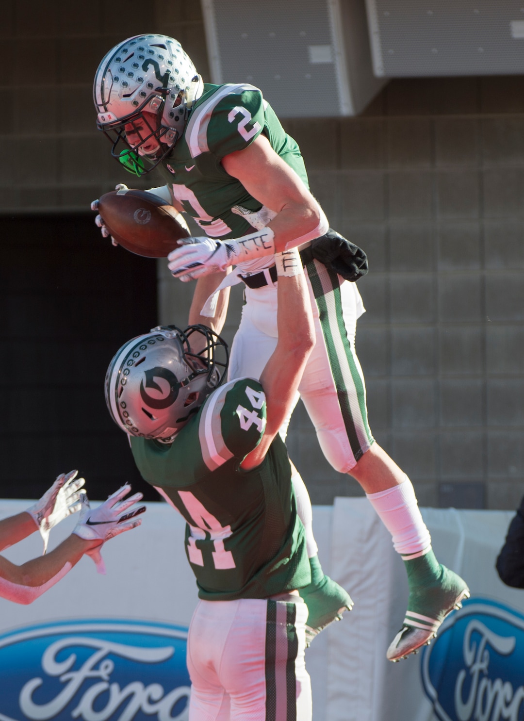 (Rick Egan  |  The Salt Lake Tribune)    Lincoln Draper (44) celebrates the touchdown by Olympus running back Tommy Poulton (2), in 5A football semifinal action between Olympus and Corner Canyon at Rice-Eccles Stadium, Thursday, Nov. 8, 2018.