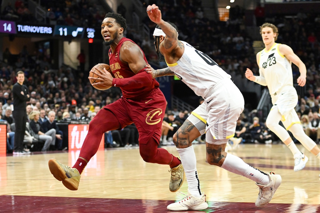 (Nick Cammett | AP Photo) Cleveland Cavaliers guard Donovan Mitchell drives against Utah Jazz guard Jordan Clarkson during the second half of an NBA basketball game, Monday, Dec. 19, 2022, in Cleveland.