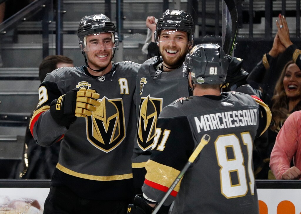 Vegas Golden Knights defenseman Shea Theodore, center, celebrates after scoring against the San Jose Sharks during the second period of Game 1 of an NHL hockey second-round playoff series, Thursday, April 26, 2018, in Las Vegas. (AP Photo/John Locher)
