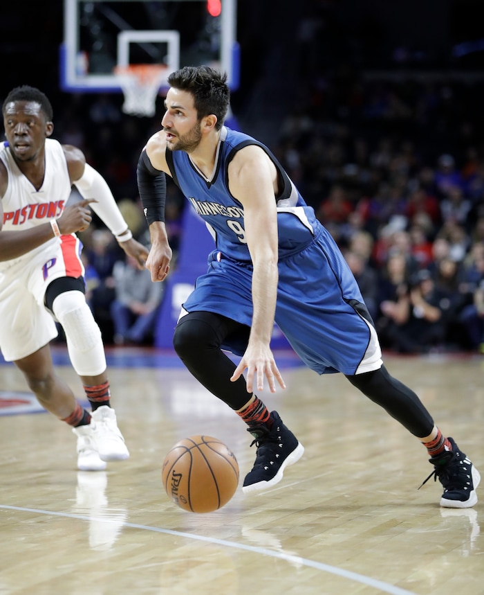 Minnesota Timberwolves guard Ricky Rubio drives around Detroit Pistons guard Reggie Jackson during the first half of an NBA basketball game, Friday, Feb. 3, 2017, in Auburn Hills, Mich. (AP Photo/Carlos Osorio)