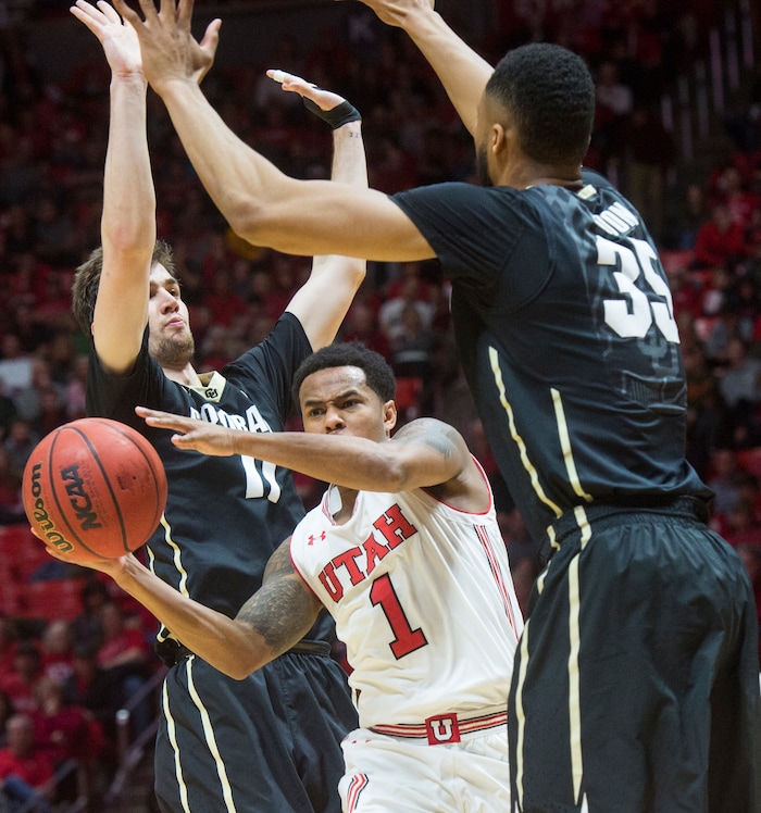 (Rick Egan  |  The Salt Lake Tribune)  Utah Utes guard Kolbe Caldwell (2) squeezes between Colorado Buffaloes guard Lazar Nikolic (11) and forward Dallas Walton (35), , in PAC-12 basketball action between Utah Utes and Colorado Buffaloes, at the Jon M. Huntsman Center, Saturday, March 3, 2018.