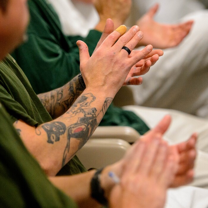 (Trent Nelson | The Salt Lake Tribune)
Inmates applaud as Gage King, an inmate at the Utah State Prison, delivers a speech at a meeting of the New Visions Speech Club in the prison's Promontory facility in Draper on Tuesday Dec. 3, 2019.