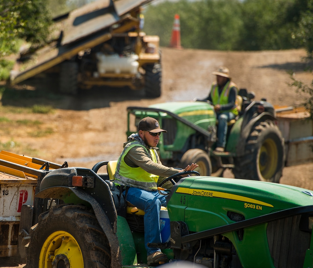 (Leah Hogsten  |  The Salt Lake Tribune)  Cherry Hill Farms employee Jesus Caballo and his fellow coworkers will spend the next 3 weeks, working 24-hours a day, shaking trees and collecting some 230,000 pounds of cherries every 8 hour shift during the July cherry harvest,Thursday, July 26, 2018.