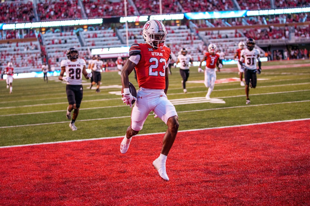 (Trent Nelson  |  The Salt Lake Tribune) Utah Utes running back Dijon Stanley (23) runs for a touchdown as the Utah Utes host the Southern Utah Thunderbirds, NCAA football in Salt Lake City on Thursday, Aug. 29, 2024.