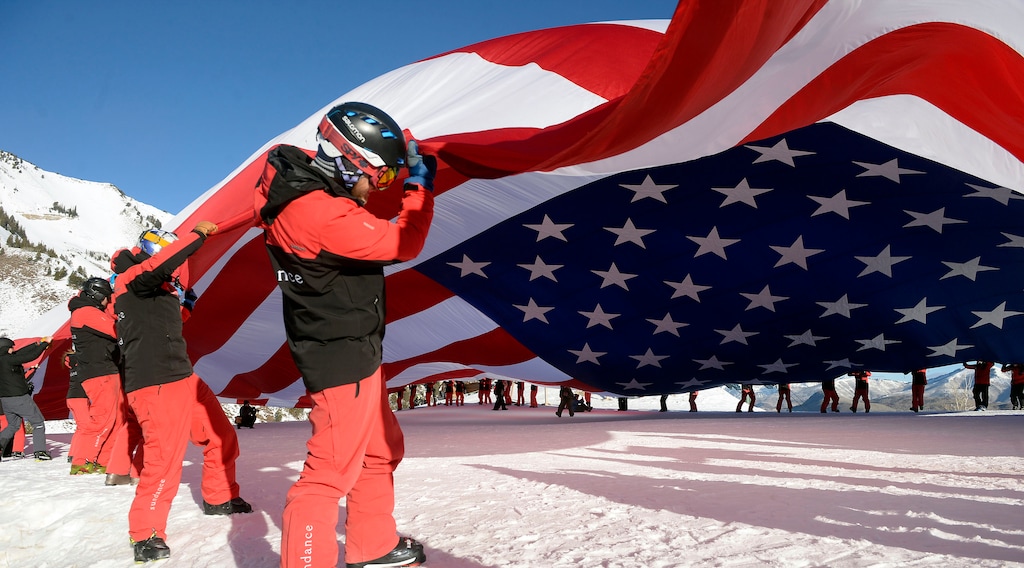 (Al Hartmann | The Salt Lake Tribune)
Sundance Mountain Resort partnered with Follow the Flag to ski a giant American Flag down Bearclaw run. The flag is 78' x 150' and weighs more than 400 pounds, the largest free-flying American flag in the world. It took coordination of 50 of Sundance's best skiers to pull it off. They did a dry run unfurling the massive flag at the top of the mountain before putting on the skis. This event is to express patriotism and support of Team USA and athletes representing the country in the upcoming Winter Olympics in Pyeongchang, South Korea.