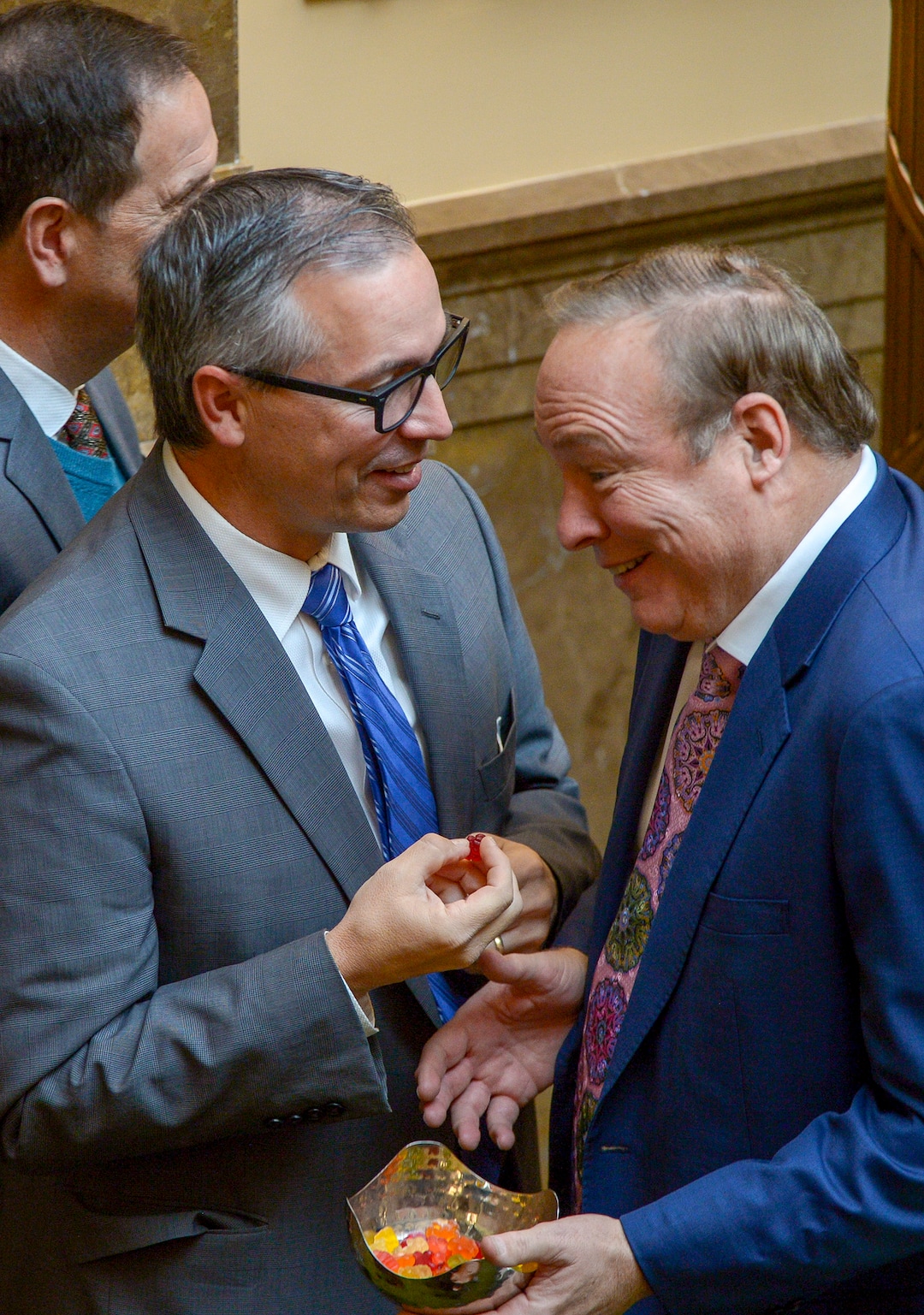 (Leah Hogsten  |  The Salt Lake Tribune)  Rep Daniel McCay, R-Riverton takes a gummy bear from outgoing State Sen. Jim Dabakis. Debakis who jokingly offered Utah House members candy gummy bears that look similar to marijuana-infused edibles. Utah legislators voted to change the Utah Medical Cannabis Act, the bill that officials, Prop 2 opponents and medical marijuana advocates crafted and pitched as a compromise. On Monday, Dec. 2, 2018 during the special session, lawmakers overhauled the medical cannabis distribution system, reduces the number of medical marijuana outlets, prohibits edibles for gelatin cubes instead and changes the list of illnesses that qualify for cannabis treatments.