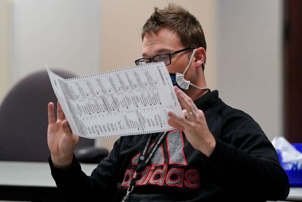 (Rick Bowmer | The Associated Press) An election worker checks ballots in the elections management center at the Salt Lake County Government Center Tuesday, Nov. 3, 2020, in Salt Lake City.