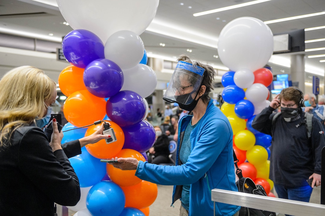 (Trent Nelson  |  The Salt Lake Tribune) Southwest Airlines' Holly Davies checks in passengers for the first flight out of concourse B at the Salt Lake City International Airport on Tuesday, Oct. 27, 2020.