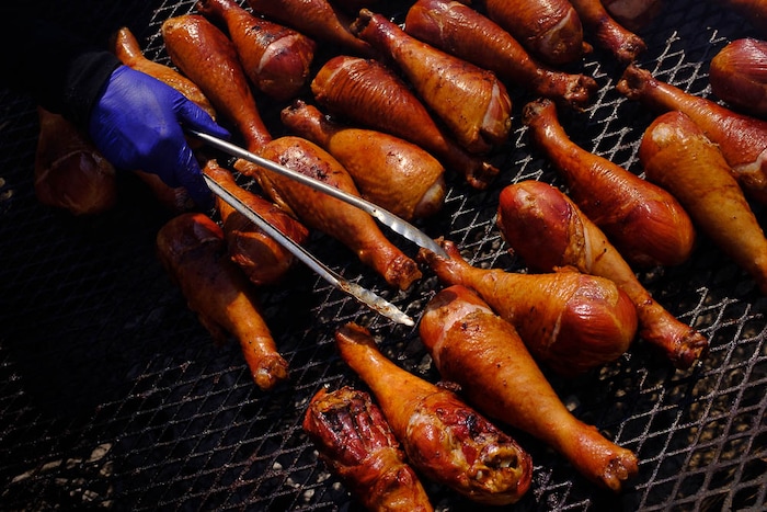 (Trent Nelson | The Salt Lake Tribune)  
Turkey legs on the grill at the Utah State Fair, Sunday Sept. 9, 2018.