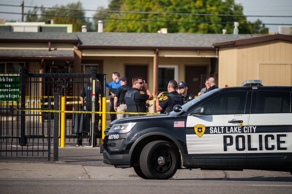(Trent Nelson  |  The Salt Lake Tribune) Police at the scene of a shooting at Wasatch Inn, on State Street in the Ballpark neighborhood of Salt Lake City, on Tuesday, Oct. 11, 2022.