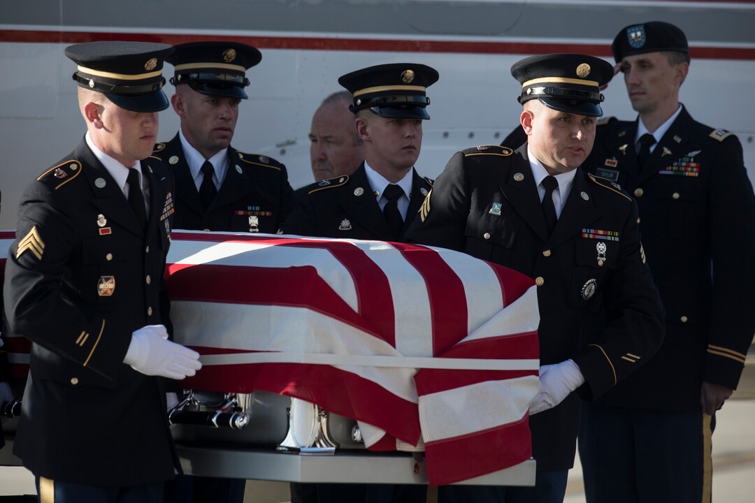 (Matt Herp  |  The Ogden Standrad Examiner/Pool) Utah National Guard Honor Guard Detail members carry a  casket containing the remains of Maj. Brent R. Taylor at Roland R. Wright Air National Guard Base in Salt Lake City, Utah, on Wednesday, Nov. 14, 2018. Taylor, 39, of North Ogden, died Nov. 3, 2018, in Afghanistan of wounds sustained from small arms fire. His funeral is scheduled for Saturday, Nov. 17, in Ogden.
