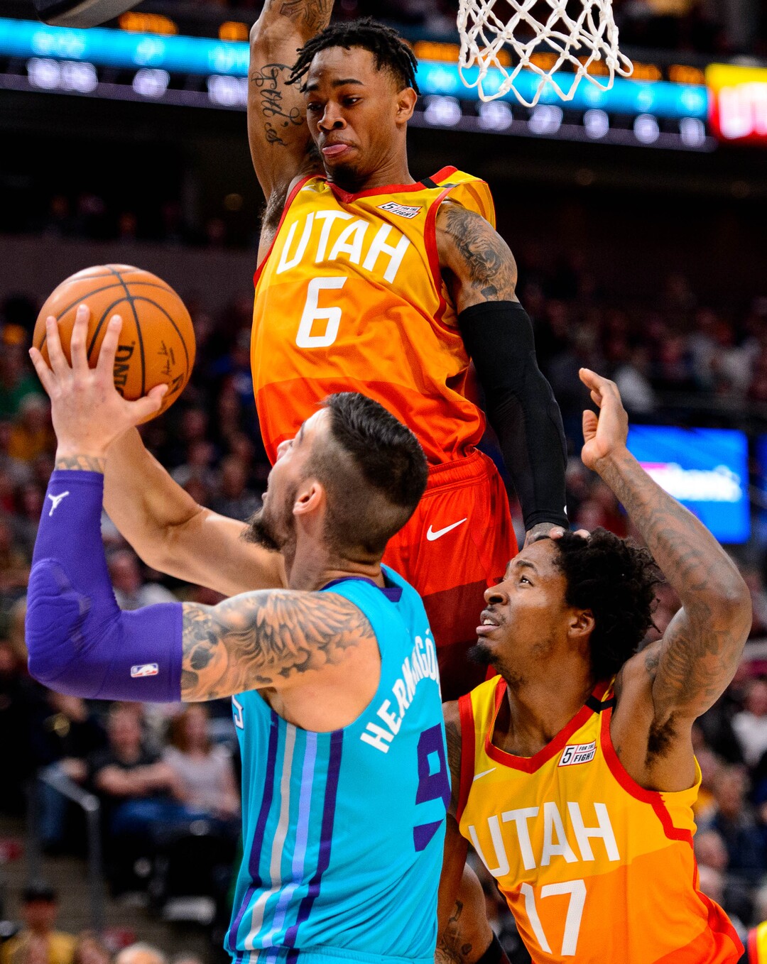(Trent Nelson  |  The Salt Lake Tribune) Raylon Tucker defending Charlotte Hornets center Willy Hernangomez (9) as the Utah Jazz host the Charlotte Hornets, NBA basketball in Salt Lake City on Friday, Jan. 10, 2020. Utah Jazz center Ed Davis (17) at right.