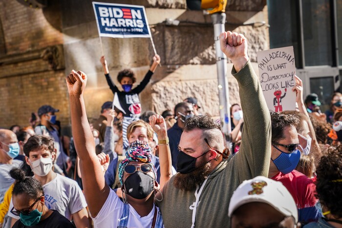 Demonstrators celebrate after the 2020 presidential election is called for President-elect Joe Biden, Saturday, Nov. 7, 2020, in Philadelphia. (AP Photo/John Minchillo)