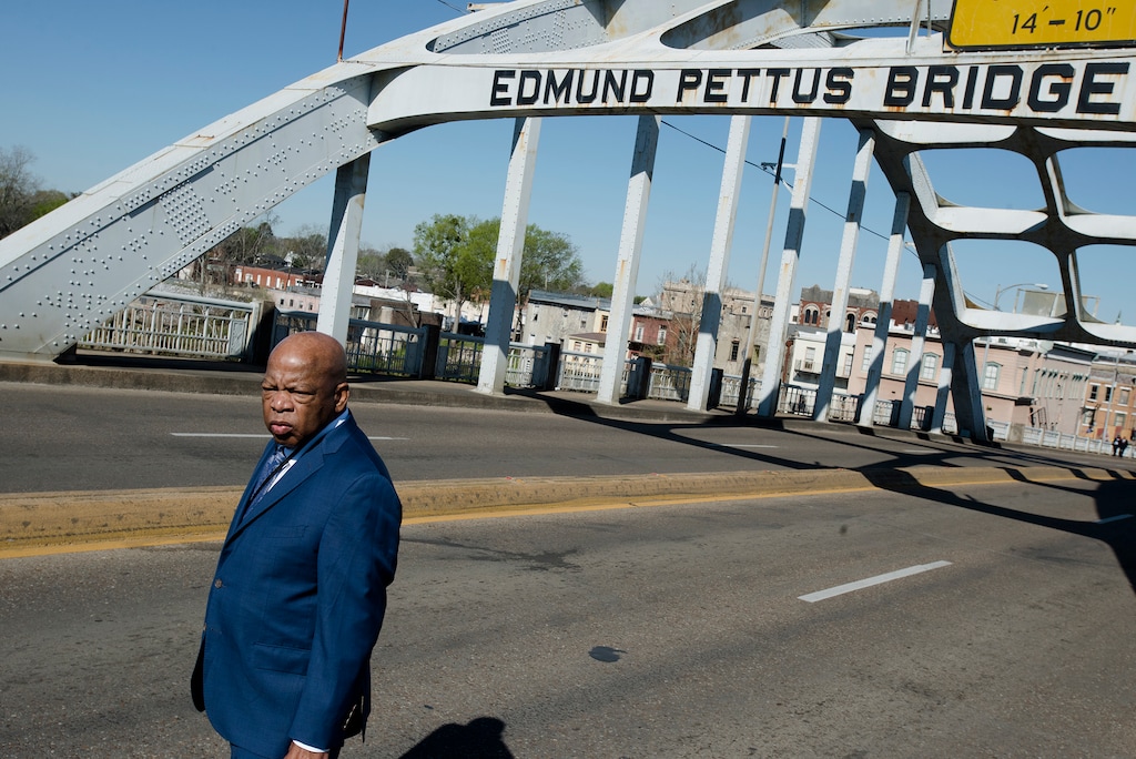 (Albert Cesare | The Montgomery Advertiser via AP file photo)  Congressman John Lewis stands on the Edmund Pettus Bridge on Sunday, March 4, 2018, in Selma, Ala., during the annual commemoration of "Bloody Sunday," the day in 1965 when voting rights protesters were attacked by police as they attempted to cross the Edmund Pettus Bridge.